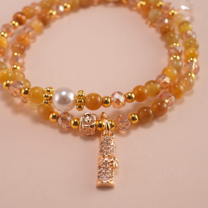 Close-up of Tiger Eye and White Crystal beads showing texture and shimmer