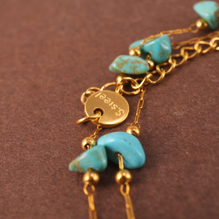 Detail of polished turquoise green beads and double-layer design