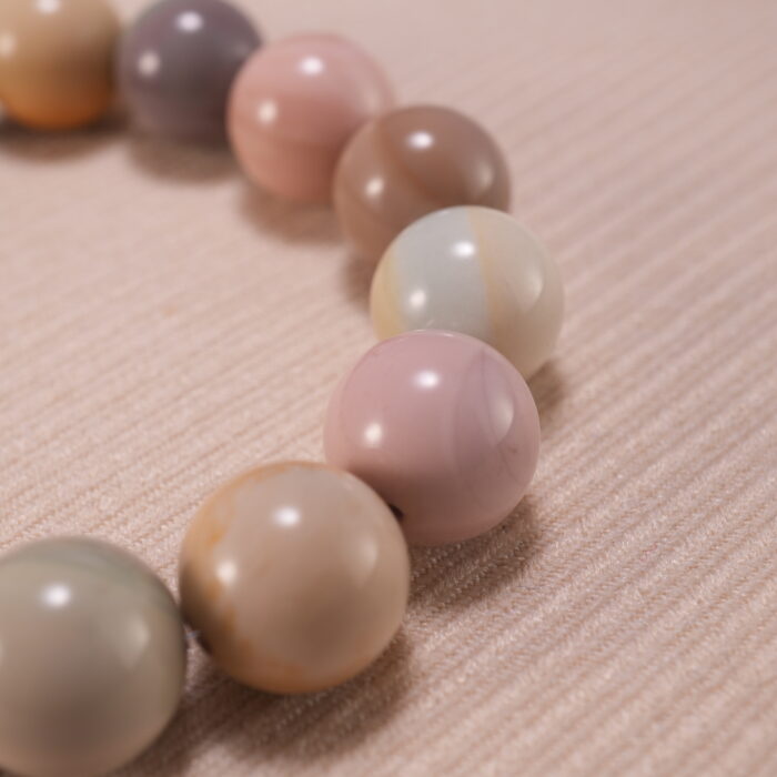 Close-up of natural stone heart bracelet showing handcrafted details