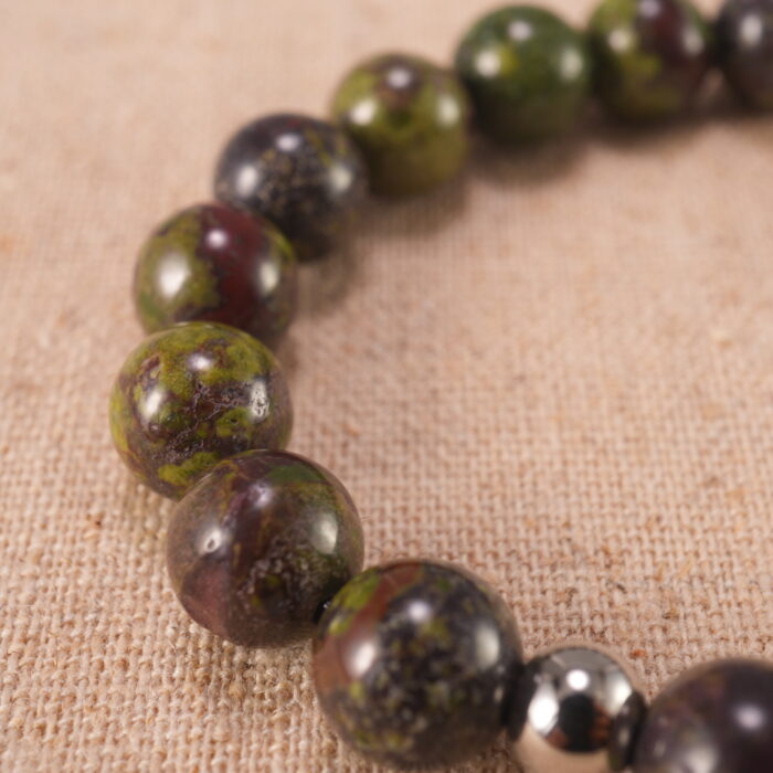 Close-up of smooth Bloodstone beads strung tightly for durability