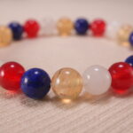 Close-up of Handmade Lapis Lazuli, Red Agate, Citrine & White Chalcedony beads with S925 sterling silver accents