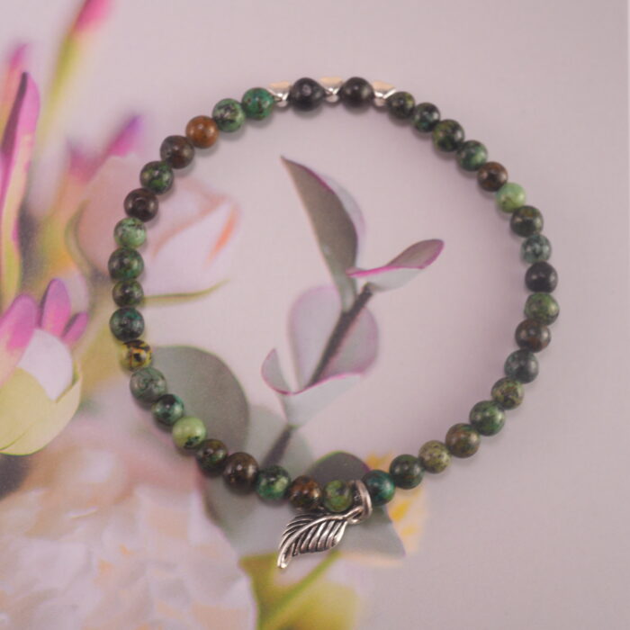 Jade Charm Bracelet on Wooden Background – Symbol of Peace and Growth