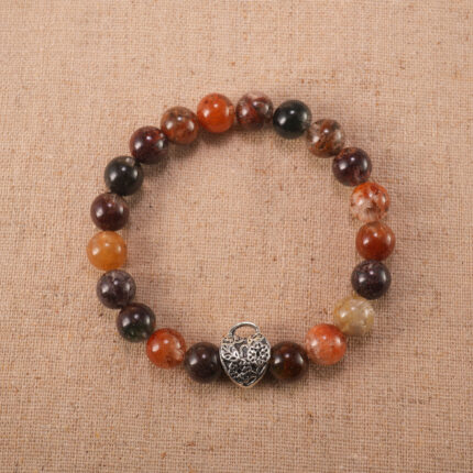 Handcrafted gemstone bracelet with Phantom Quartz beads and S925 silver clasp on clean background