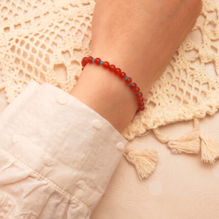 Woman wearing 4mm red agate and apatite bracelet – elegant natural stone jewelry for energy