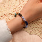 Model wearing Sagittarius jewelry zodiac bracelet with gemstone beads