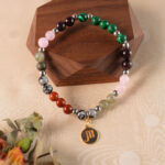Scorpio bracelet displayed on rustic wooden surface highlighting natural stones