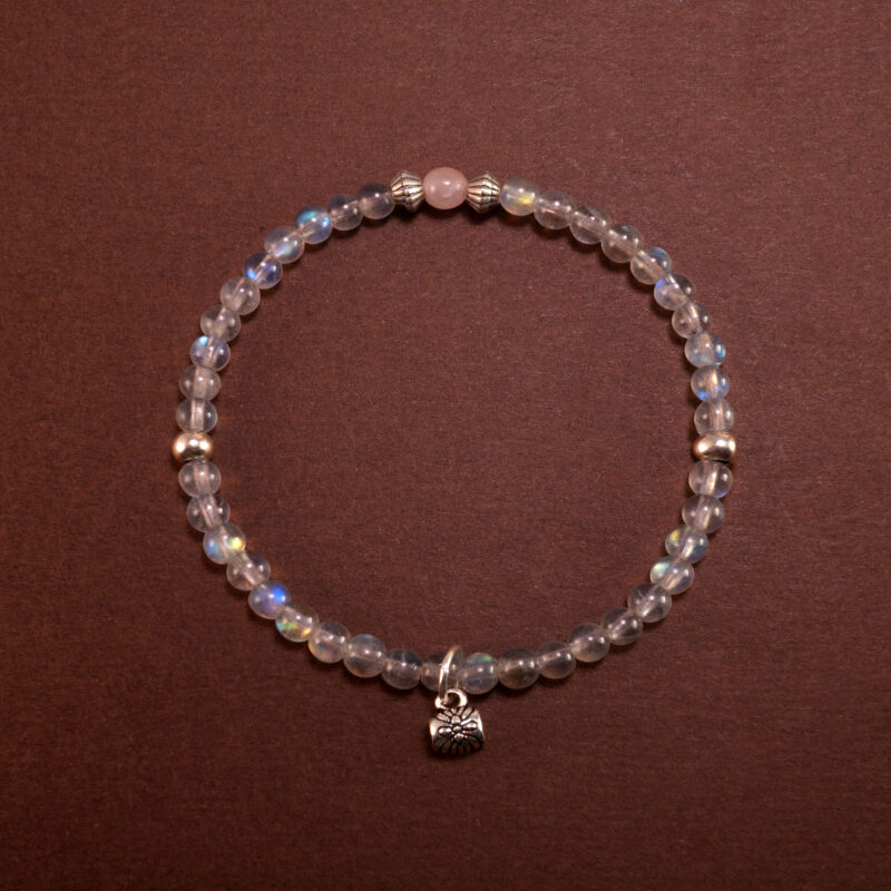 Handmade Chalcedony bracelet with floral and leaf charms, designed to promote restful sleep