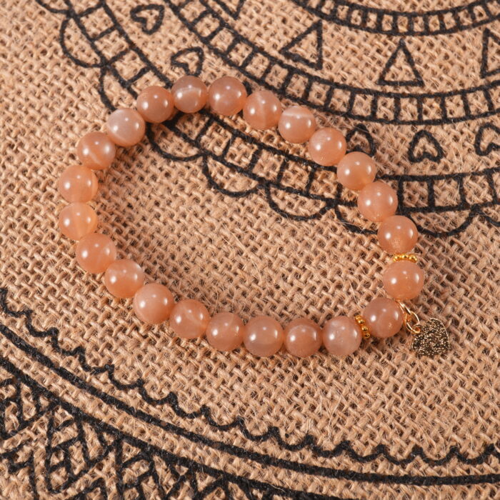 Bracelet placed gently in a soft natural setting, evoking warmth and feminine energy