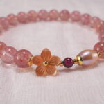 Close-up of Strawberry Quartz Beads, Pearls and Flower Charm – Elegant Handmade Bracelet