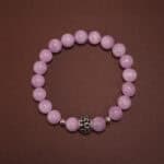 8mm kunzite bracelet with soft lavender-pink tones on white background