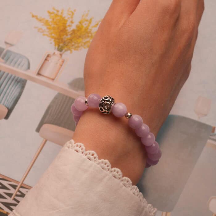 Worn on wrist to highlight the gentle color and polished 8mm beads