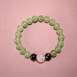 Prehnite, Moonstone & Obsidian 8mm gemstone bracelet on white background