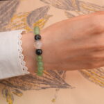 Model wearing the mixed gemstone 8mm healing bracelet