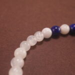 Close-up of deep blue lapis and soft white chalcedony beads