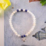 Lapis lazuli star bracelet styled on a moonlit book or celestial background