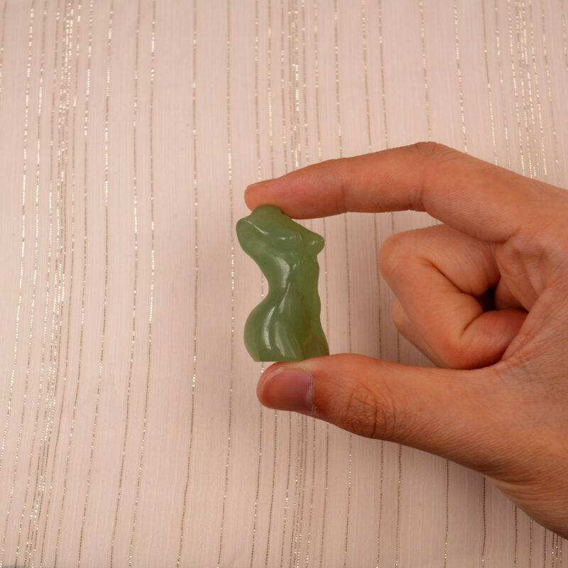 Hand holding Natural Green Onyx Model Figurine, showing its elegant shape and natural green color patterns