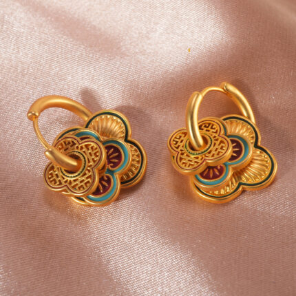 Red and blue color block floral hoop earrings on a clean background