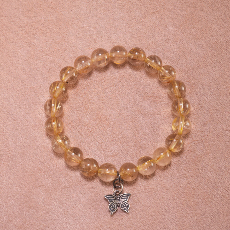 Golden rutilated quartz butterfly charm bracelet – 8mm crystal beads