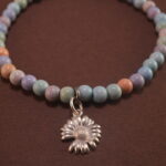 Close-up of Alashan agate bracelet with silver detail.