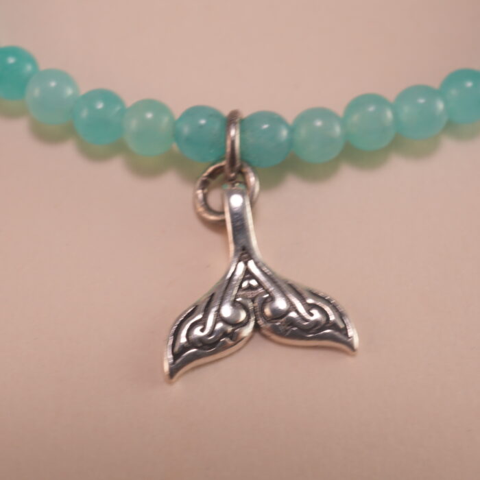 Close-up of amazonite bracelet with silver accents.