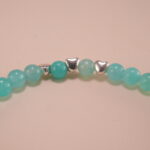 Close-up of amazonite bracelet with silver accents.