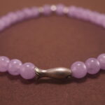 Close-up of amethyst bracelet with silver accents.