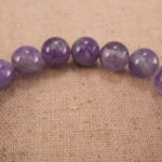 Close-up of amethyst bracelet with S925 silver beads.