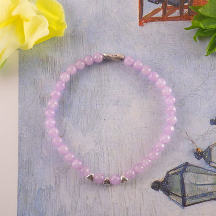 Amethyst bracelet in daylight with deep violet tone.