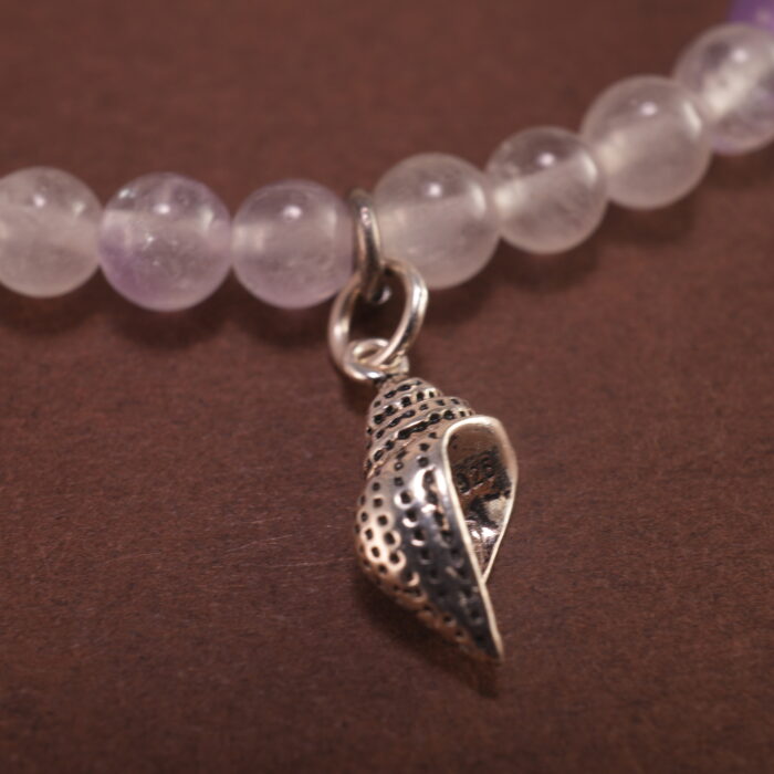Close-up of amethyst and white chalcedony bracelet with silver.