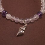 Close-up of amethyst and white chalcedony bracelet with silver.