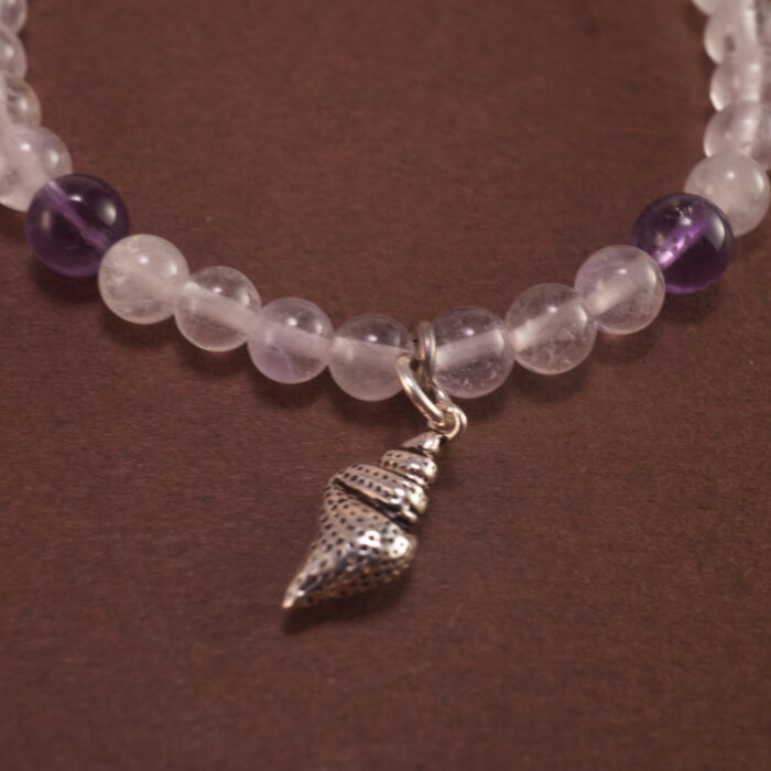Close-up of amethyst and white chalcedony bracelet with silver.