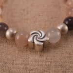 Close-up of aventurine bracelet with S925 silver bead accents.