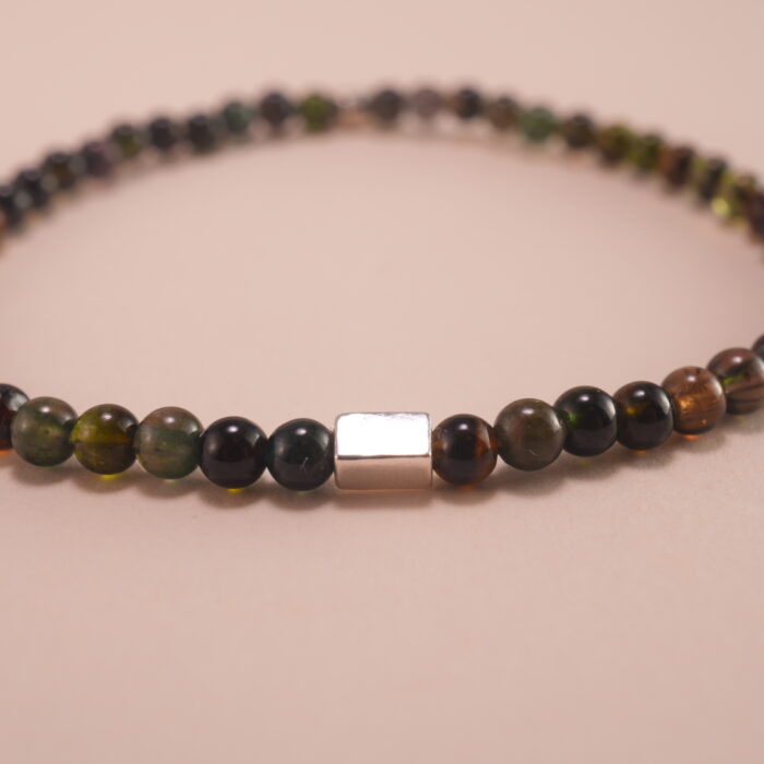 Close-up of dark tourmaline bracelet with silver.