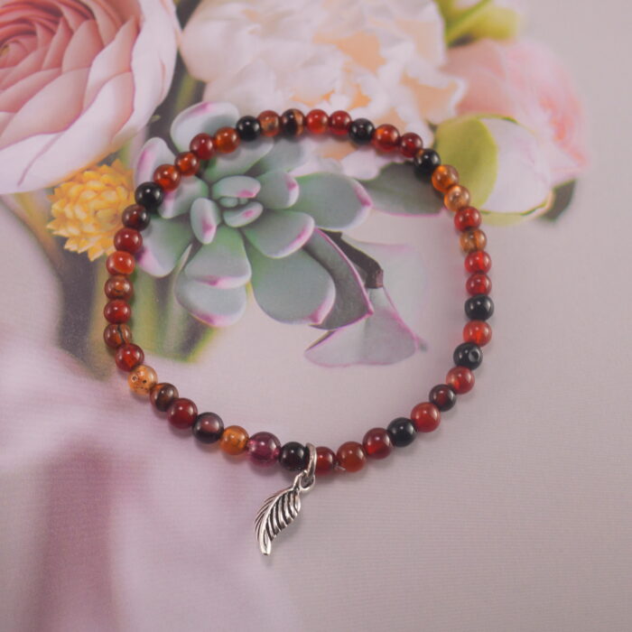 Bracelet in natural light showing deep red tones.