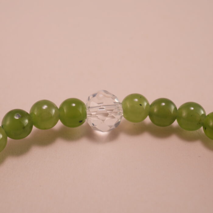 Close-up of green chalcedony and amethyst bracelet with silver.