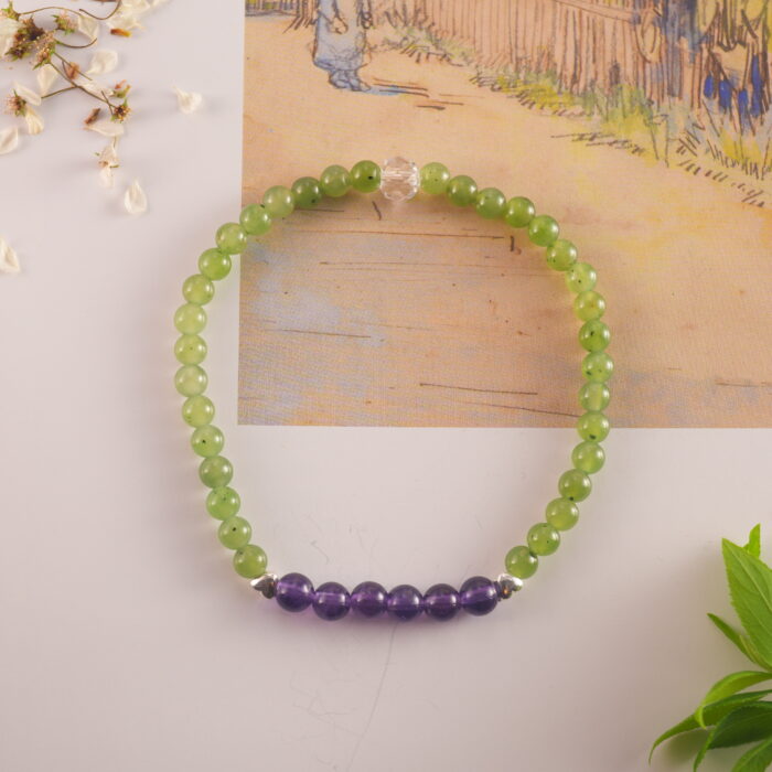 Bracelet in natural light showing soft green and violet hues.