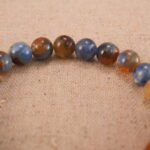 Close-up of kyanite bracelet with S925 silver accents.