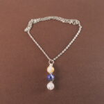 Libra zodiac necklace with citrine, lapis lazuli, and clear quartz gemstones.