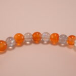 Close-up of orange chalcedony and gray moonstone bracelet with silver.