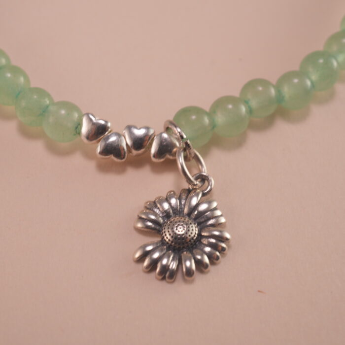 Close-up of prehnite bracelet with silver accent.