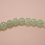 Close-up of prehnite bracelet with silver accent.