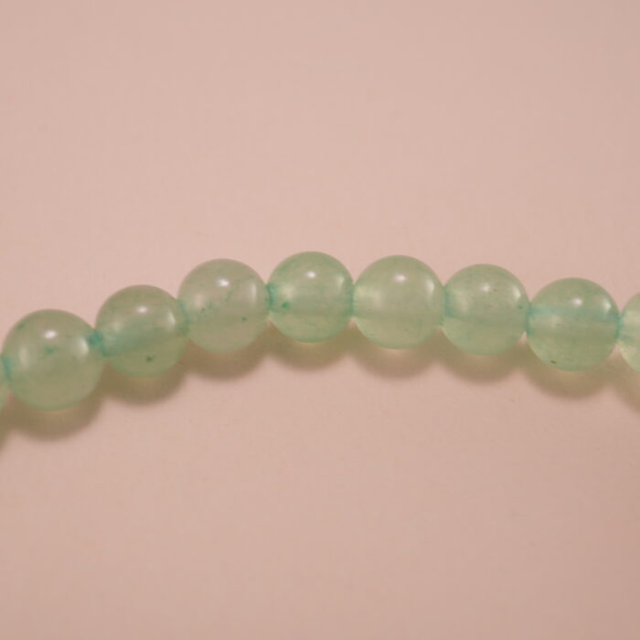 Close-up of prehnite bracelet with silver accent.