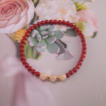 Bracelet in natural light showing warm red and soft white.