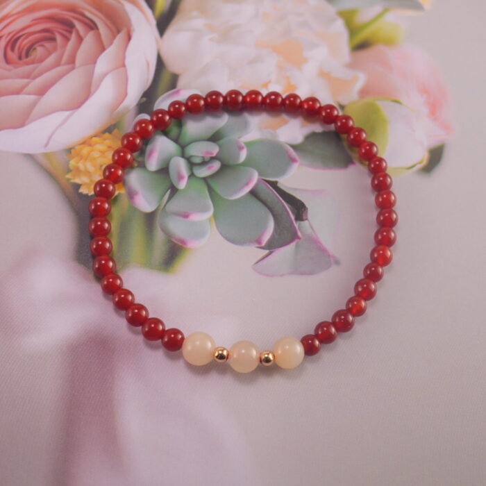 Bracelet in natural light showing warm red and soft white.
