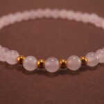 Close-up of rose quartz bracelet.