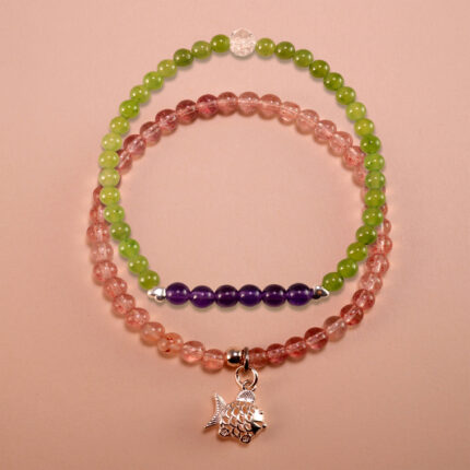 Main image of stacked green chalcedony, amethyst and strawberry quartz bracelets.