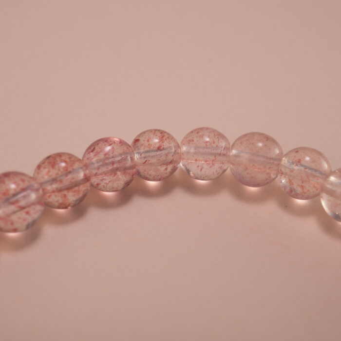 Close-up of strawberry quartz bracelet with silver.