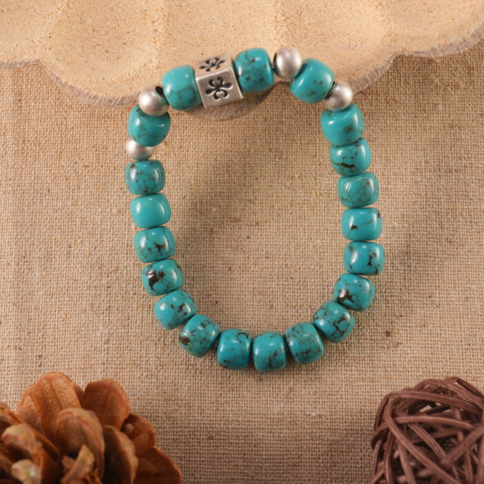 Turquoise bracelet in natural light with bold blue tones.