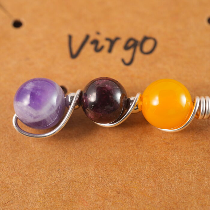 Close-up of Virgo necklace showing yellow agate, garnet, and amethyst beads.