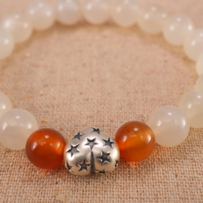 Close-up of white chalcedony and orange agate bracelet with S925 silver.
